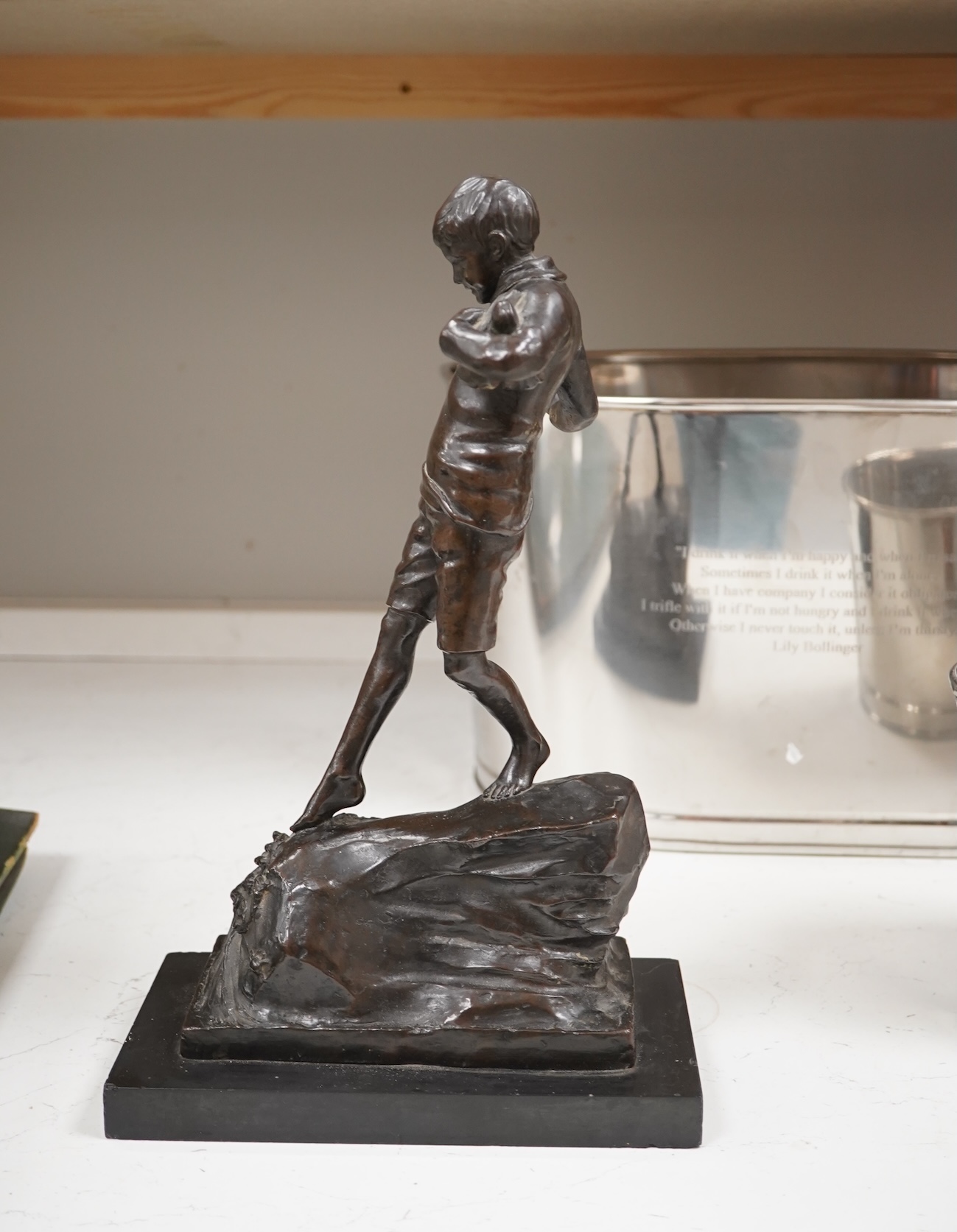 Lorna Adamson (British b.1894-?), an early 20th century bronze figure of a boy, signed and dated 1913, on marble base, 36cm. Condition - nibbles to base, otherwise good